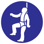 Blauw bord met pictogram om aan te duiden dat een veiligheidsharnas verplicht is